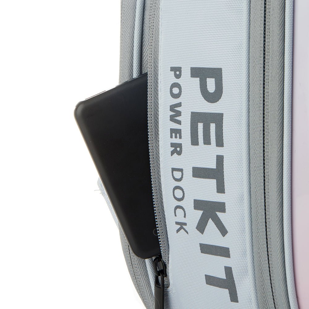 Breezy 2 Cat Carrier featuring a side zipper pocket designed to hold a power bank for powering the built-in fan and lighting system
