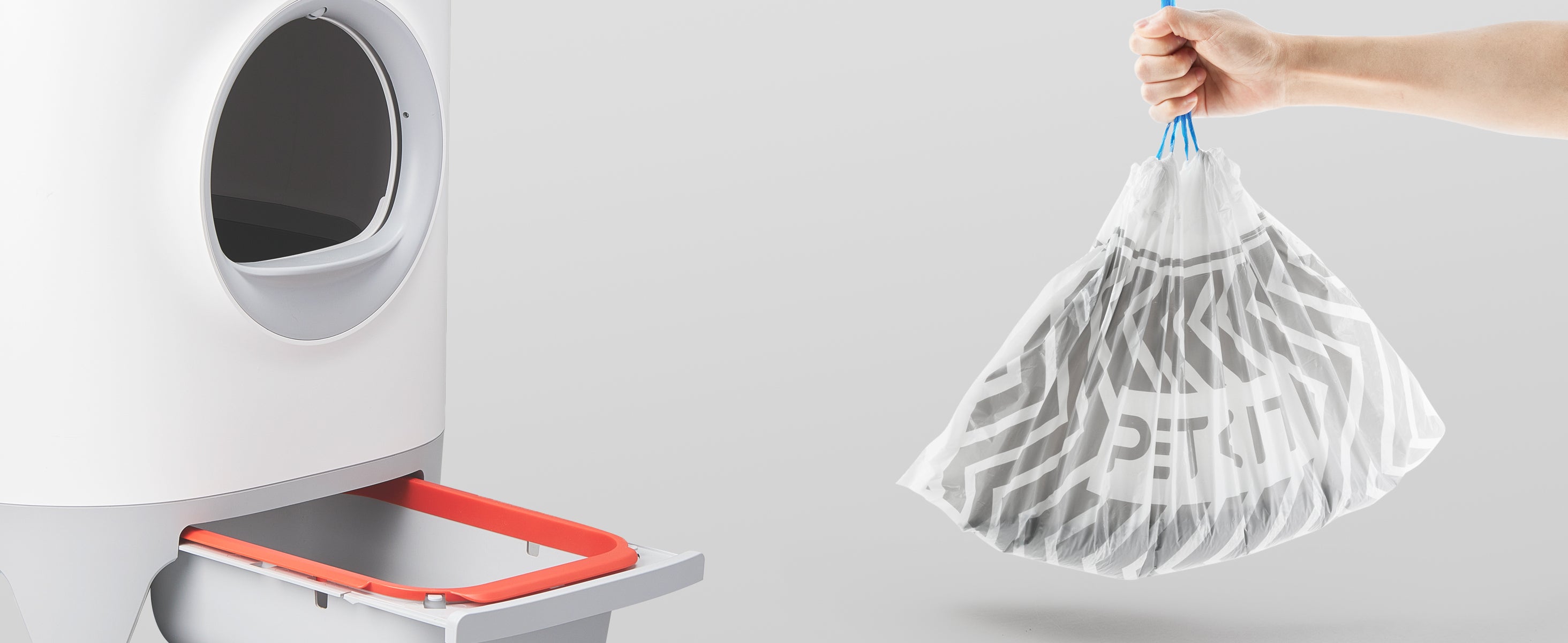 Demonstration of Automatic Litter Box Trash Bag being removed using drawstring, showing hygienic, effortless disposal