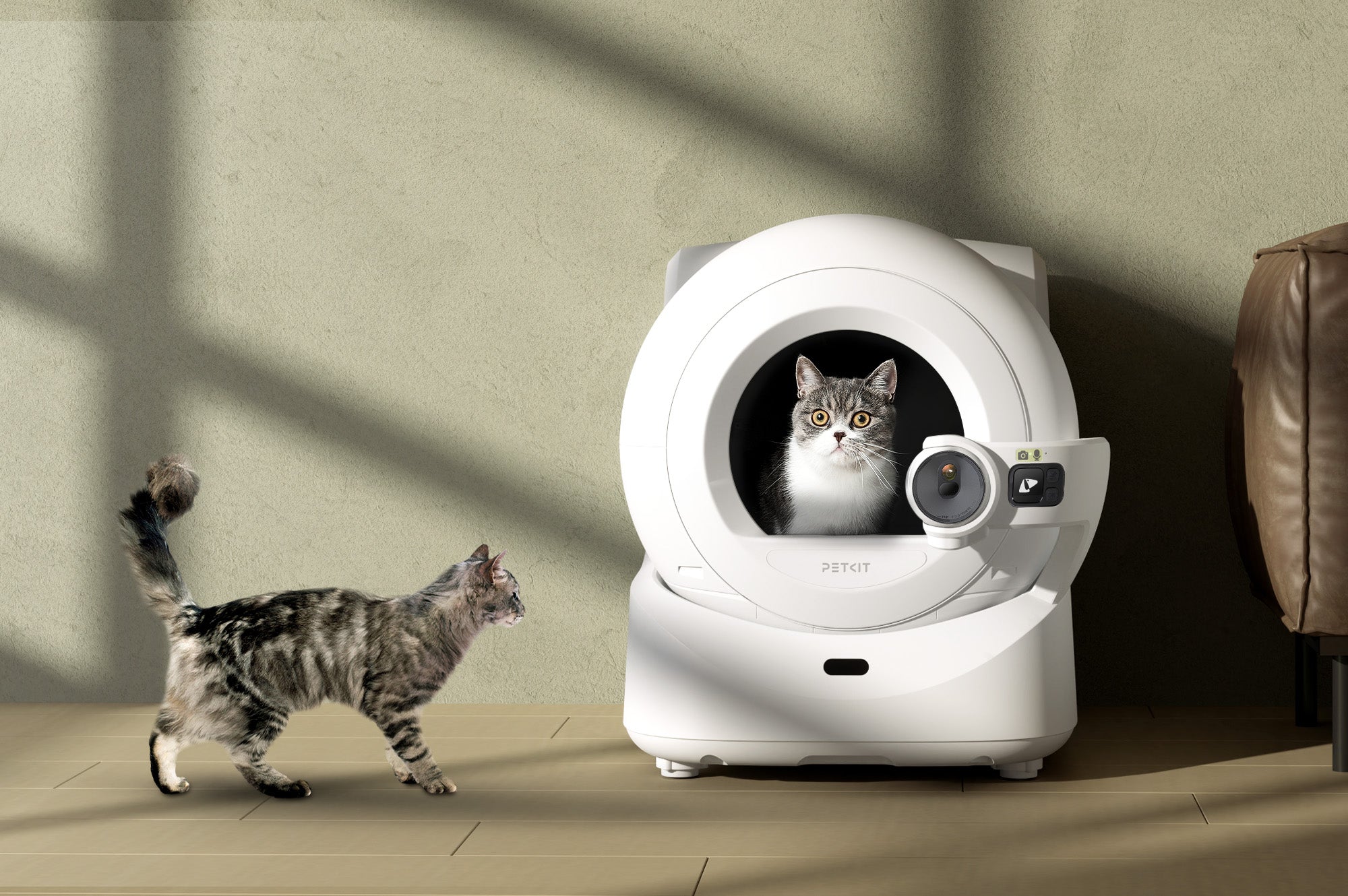 Purobot Ultra Automatic Litter Box placed in a home setting with cats using it naturally as part of daily routines
