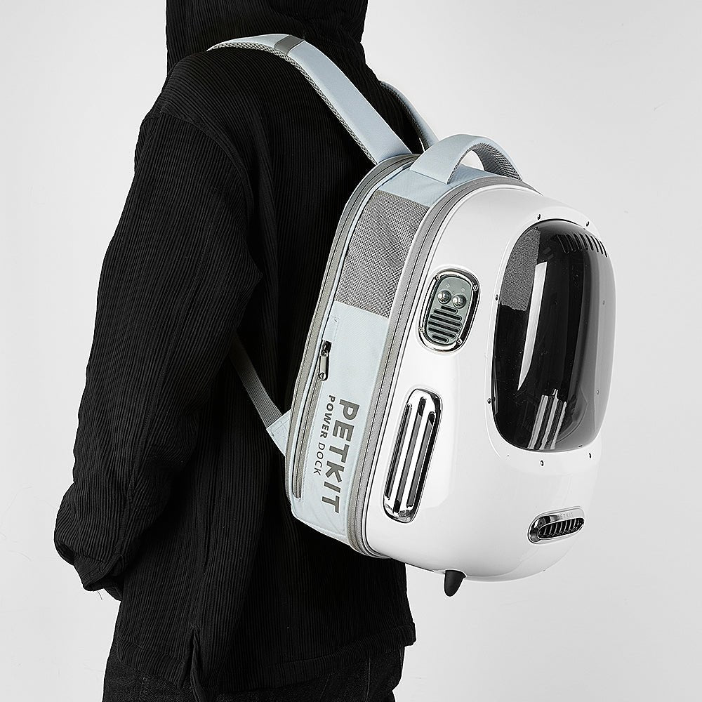 Breezy 2 Cat Carrier in cream white worn as a backpack, designed for hands-free carrying with breathable ventilation and ergonomic support